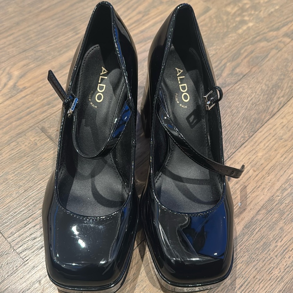 Gently worn black patent platform shoes